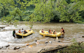 Swain STEM Camp- Kids learn to paddle rafts in the Tuckasegee River